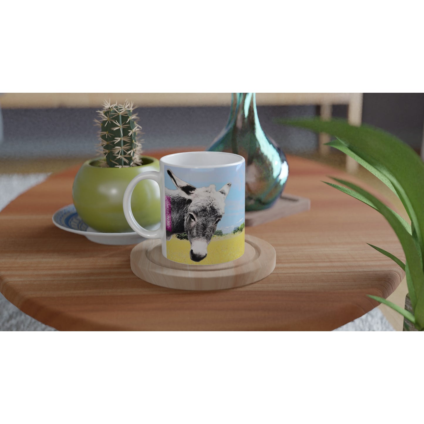 taza decorada con paisaje natural y dos burritos