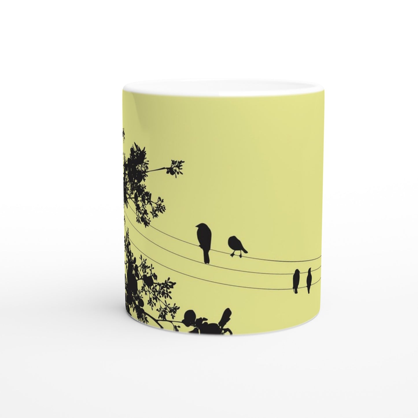 taza decorada en amarillo con pajaritos