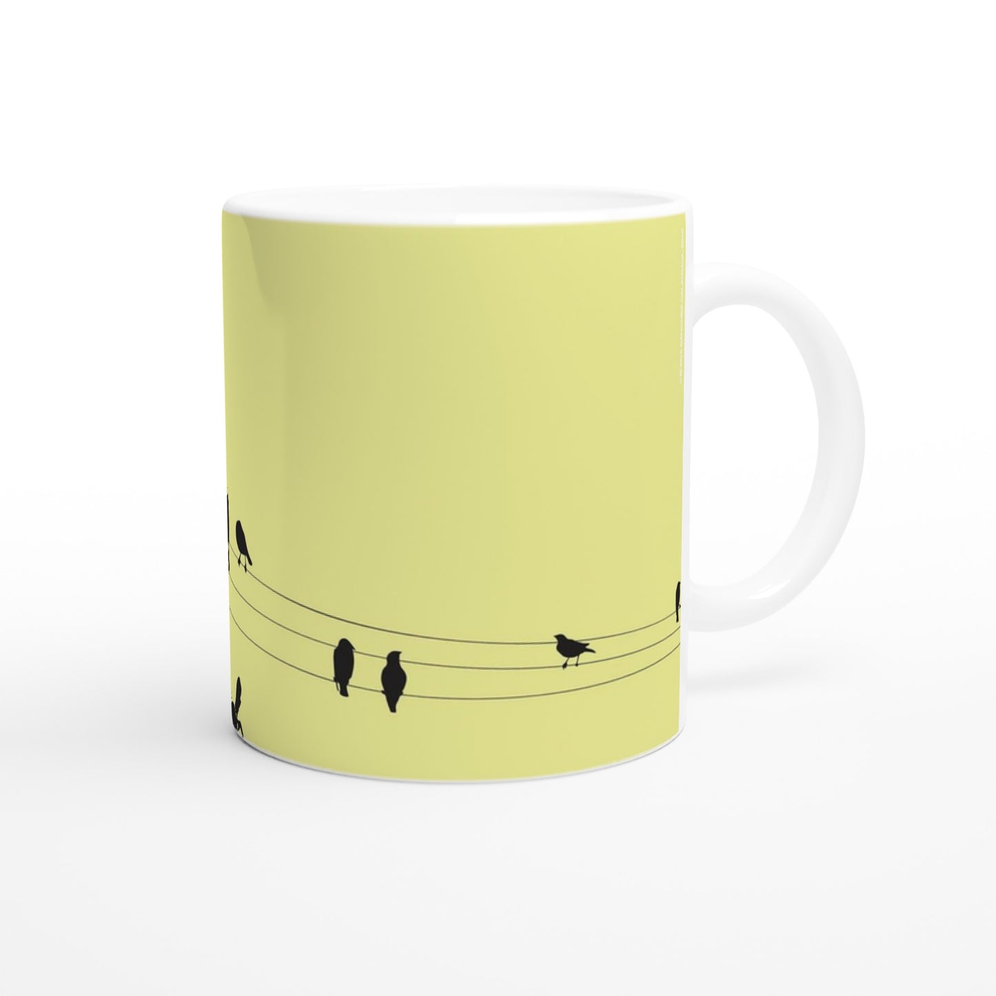 taza decorada en amarillo con pajaritos