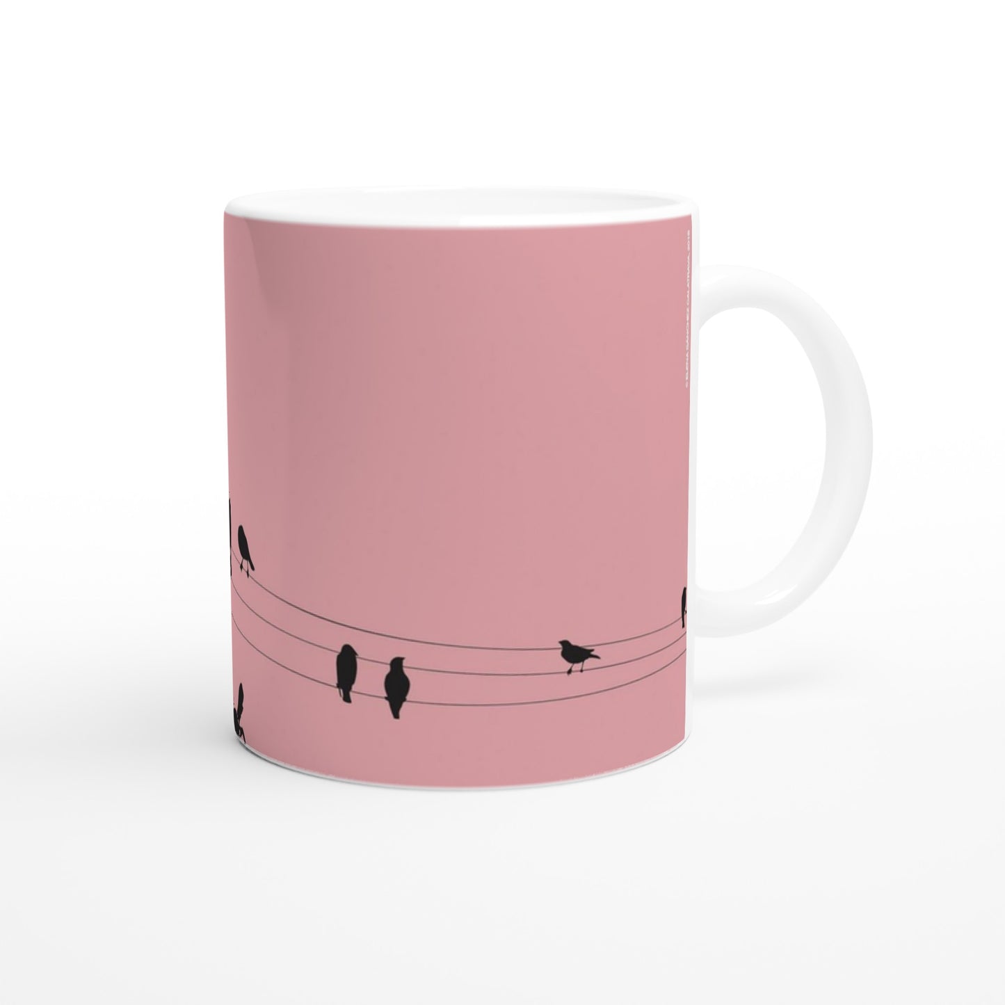 taza decorada en rosa claro con pajaritos